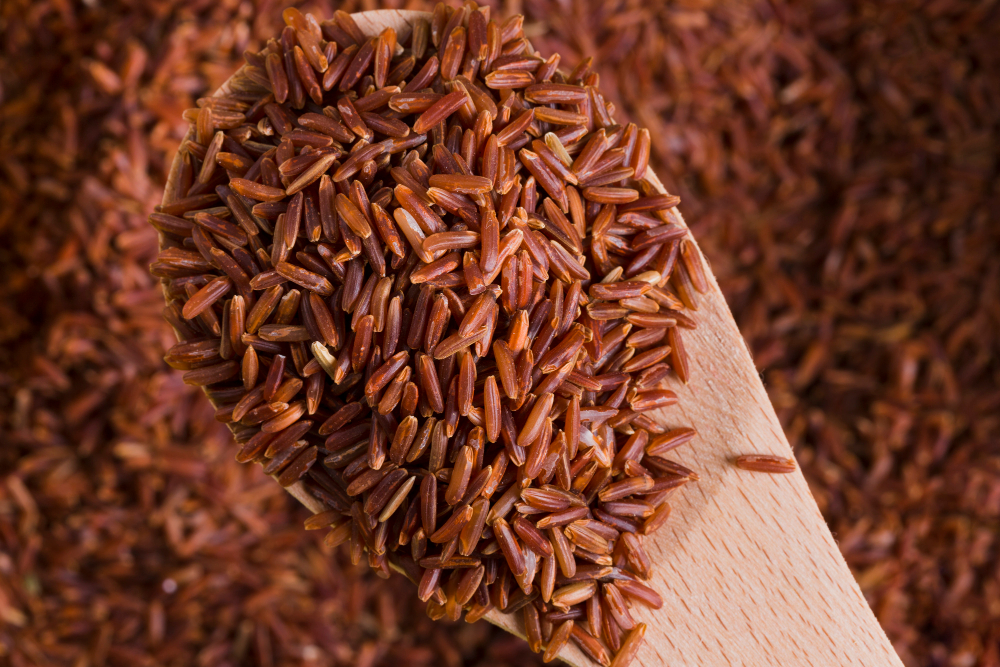 Close up of red yeast rice on spoon
