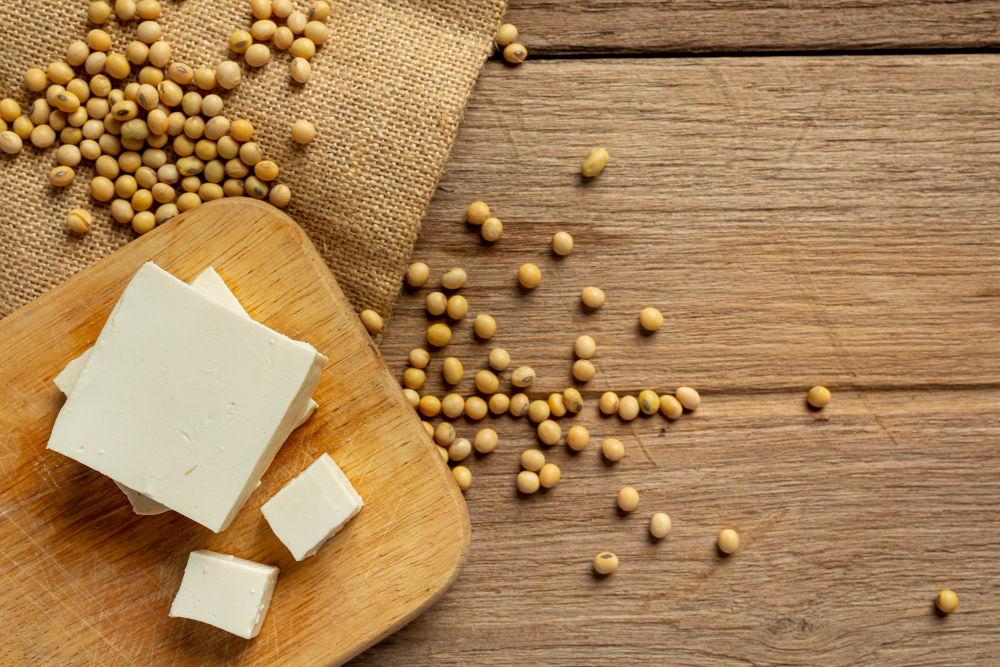 Tofu made from soy beans on wooden table